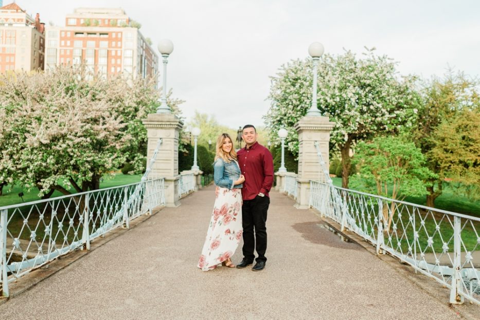 engaged couple on a bridge in boston commons